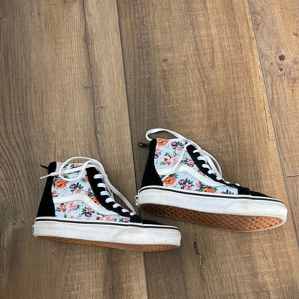 Vans black & floral high tops w/zipper on back heel. Used in great condition.
